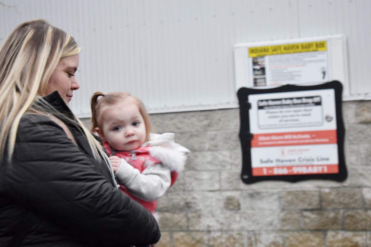 Christina Hale and her 2-year-old daughter, Rylynn Wyatt, attended a baby box dedication ceremony at the Monroe Fire Protection District station on North Old Ind. 37 in December 2022. Hale's mother initiated fundraising for the project in 2020.