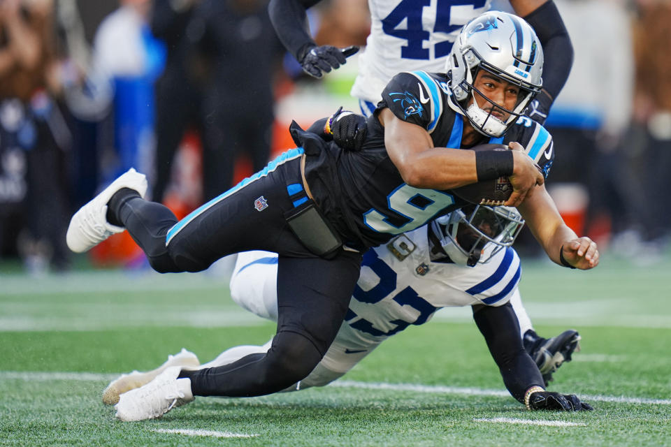 Carolina Panthers quarterback Bryce Young is tackled by Indianapolis Colts cornerback Kenny Moore II during the first half of an NFL football game Sunday, Nov. 5, 2023, in Charlotte, N.C. (AP Photo/Rusty Jones)