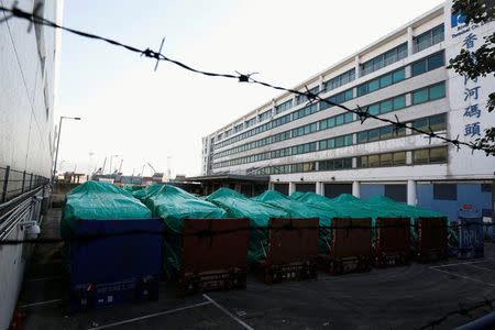 Armored troop carriers, belonging to Singapore, are detained at a cargo terminal in Hong Kong, China November 28, 2016. REUTERS/Bobby Yip/Files