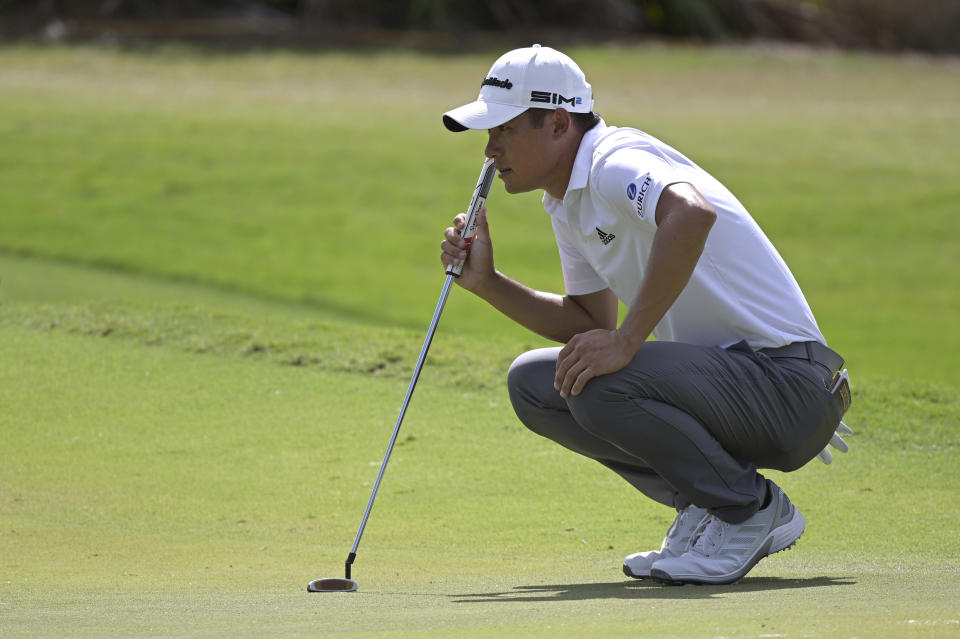 Collin Morikawa lines up a putt on the first green during the third round of the Workday Championship golf tournament, Feb. 27, 2021, in Bradenton, Fla. (AP Photo/Phelan M. Ebenhack)