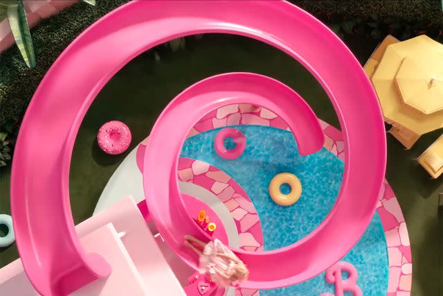 Margot Robbie travels down the pink spiral slide in the 'Barbie' movie.