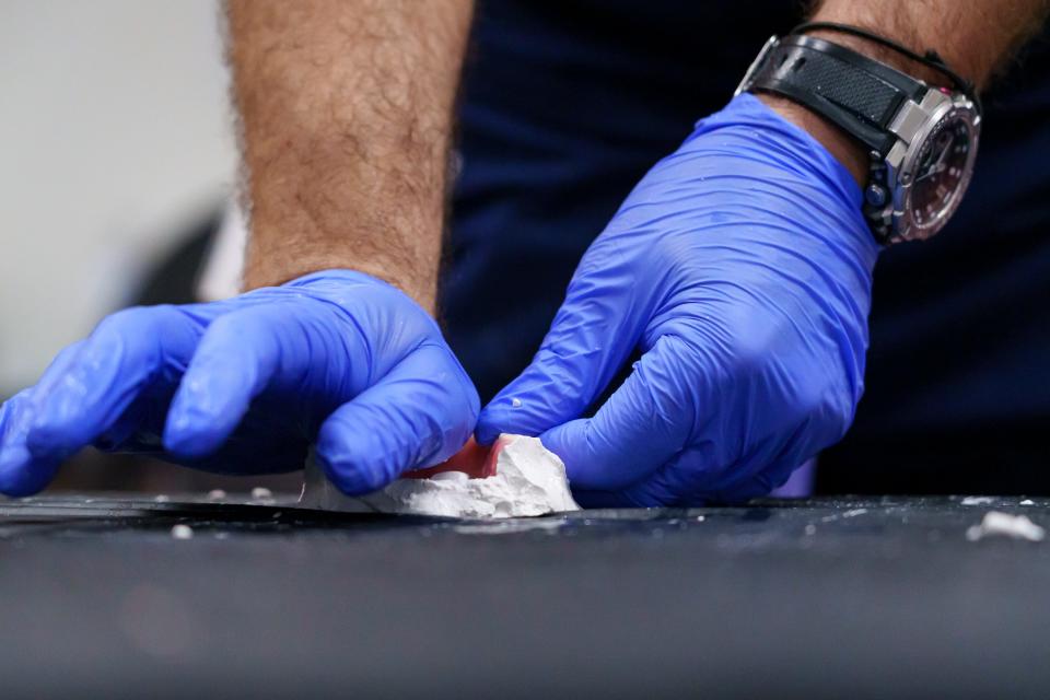 Dental technician, Damir Zega molds a set of dentures for a patient during the Arizona Dental Mission of Mercy at the Veterans Memorial Coliseum at the Arizona State Fairgrounds on Dec. 8, 2023, in Phoenix.