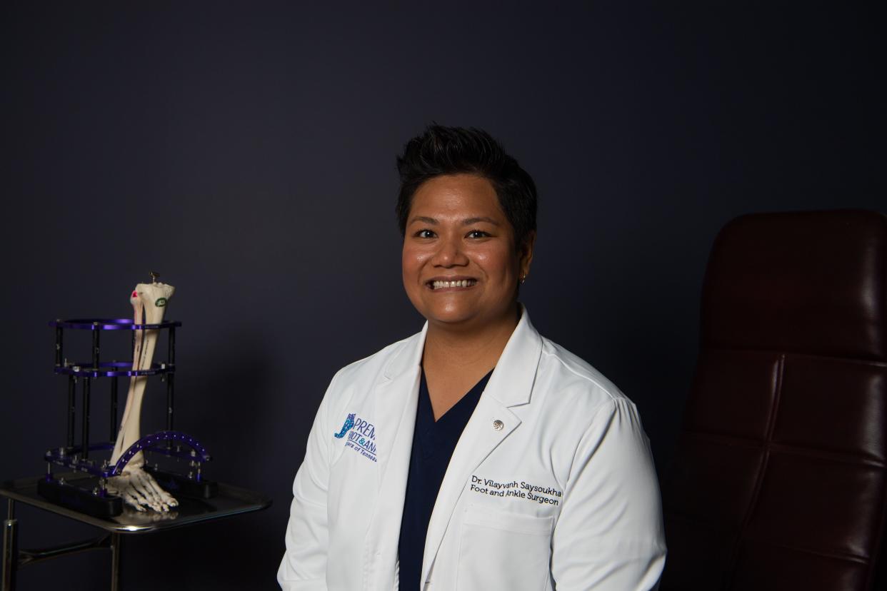 Dr. Vilayvanh Saysoukha, a podiatrist at the Premier Foot and Ankle Center in Murfreesboro, Tenn., Monday, May 20, 2024. Saysoukha is a first-generation Laotian American who was an early Tennessee HOPE scholarship recipient.