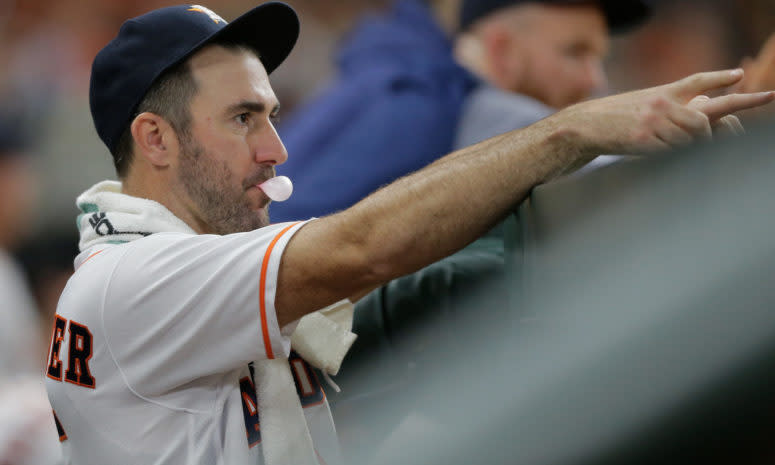 Justin Verlander blowing a bubble with his gum.