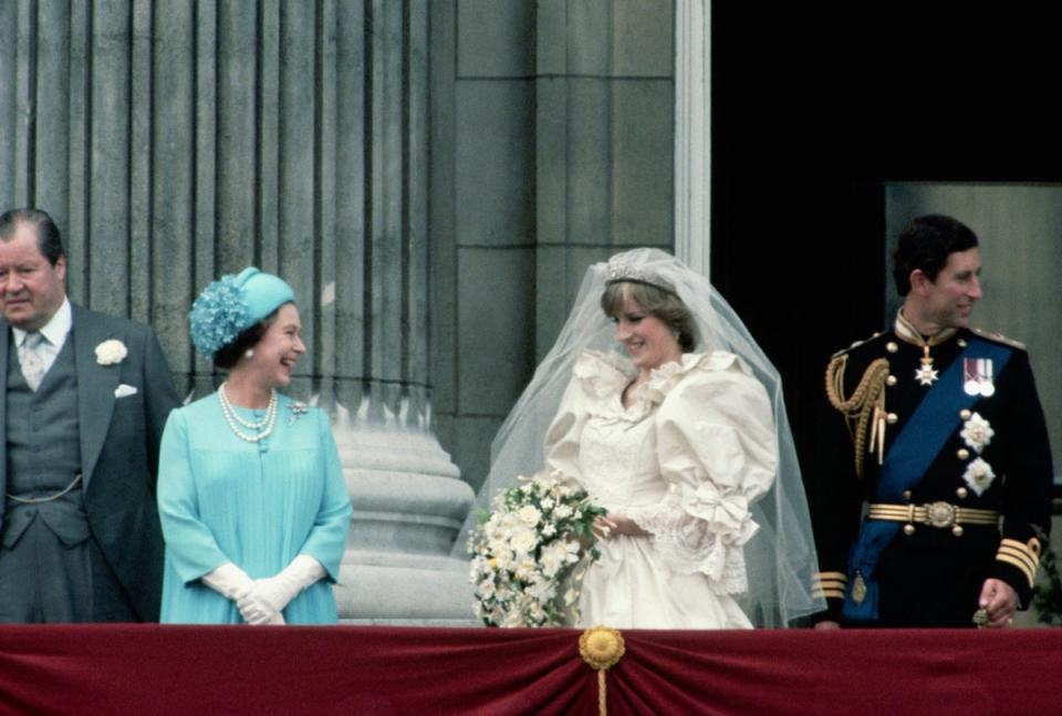 Queen Elizabeth joins the Prince and Princess of Wales on a Buckingham Palace balcony following their wedding (© Wally McNamee/CORBIS)