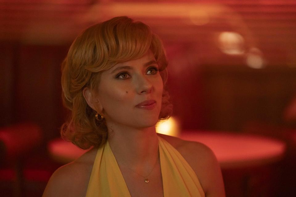 Scarlett Johansson in a yellow dress in a scene from Fly Me to the Moon