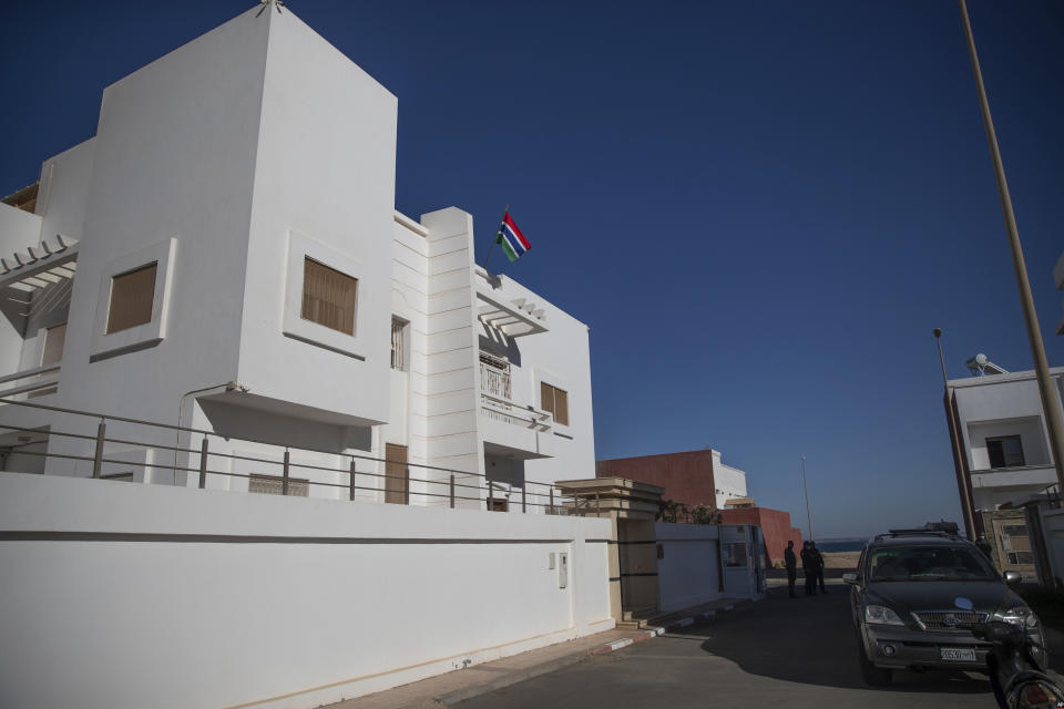 Security forces stand guard outside a recently opened consulate of The Gambia in Dakhla city, Western Sahara, Monday, Dec. 21, 2020. U.S. plans to open a consulate in Western Sahara mark a turning point for the disputed and closely policed territory. U.S. recognition of Morocco’s authority over the land frustrates indigenous Sahrawis seeking independence. But others see the future U.S. consulate as a major boost for Western Sahara cities like Dakhla. The U.S. will be joining a small but growing number of countries with consulates in the territory, the most recent representing Gambia. (AP Photo/Mosa'ab Elshamy)