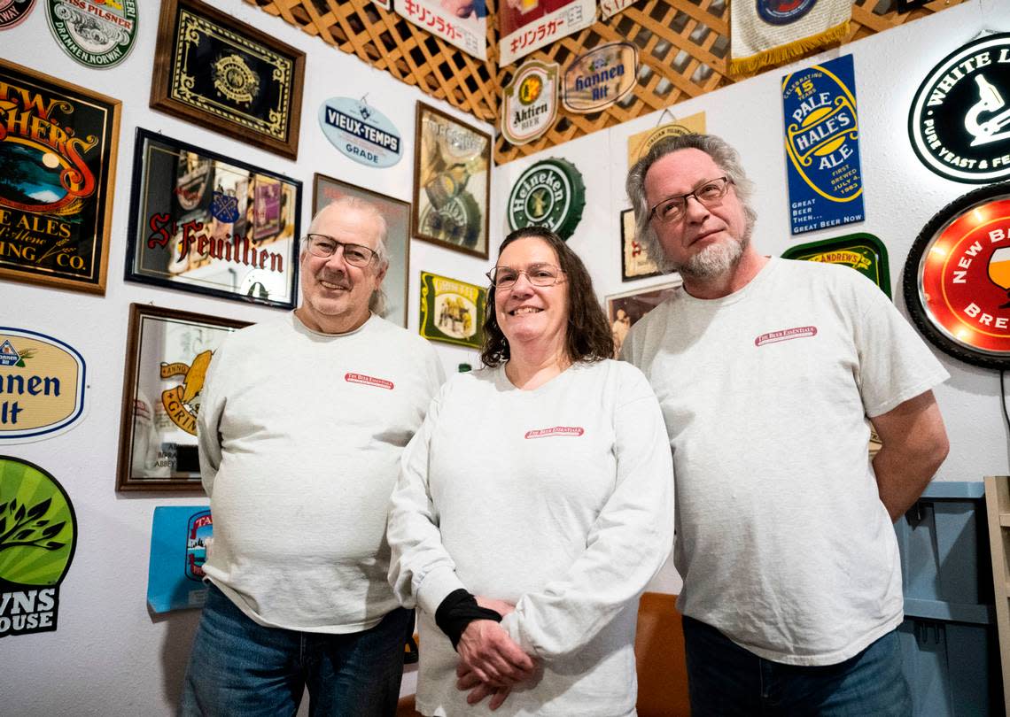 The Beer Essentials owner Enola Christian, center, poses with her store manager, Darrell Anderson, right, and sales representative, Bruce Andeway, left, at her homebrew supply store in Lakewood on Dec. 22, 2022. Christian opened the business with her late husband in 1994.