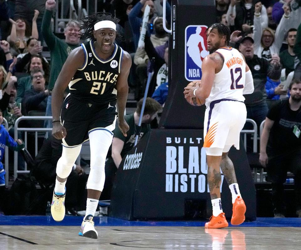 Milwaukee Bucks guard Jrue Holiday (21) celebrates after hitting a shot to tie the game against the Phoenix Suns during the fourth quarter of the Bucks 104-101 win at Fiserv Forum in Milwaukee on Sunday, Feb. 26, 2023.