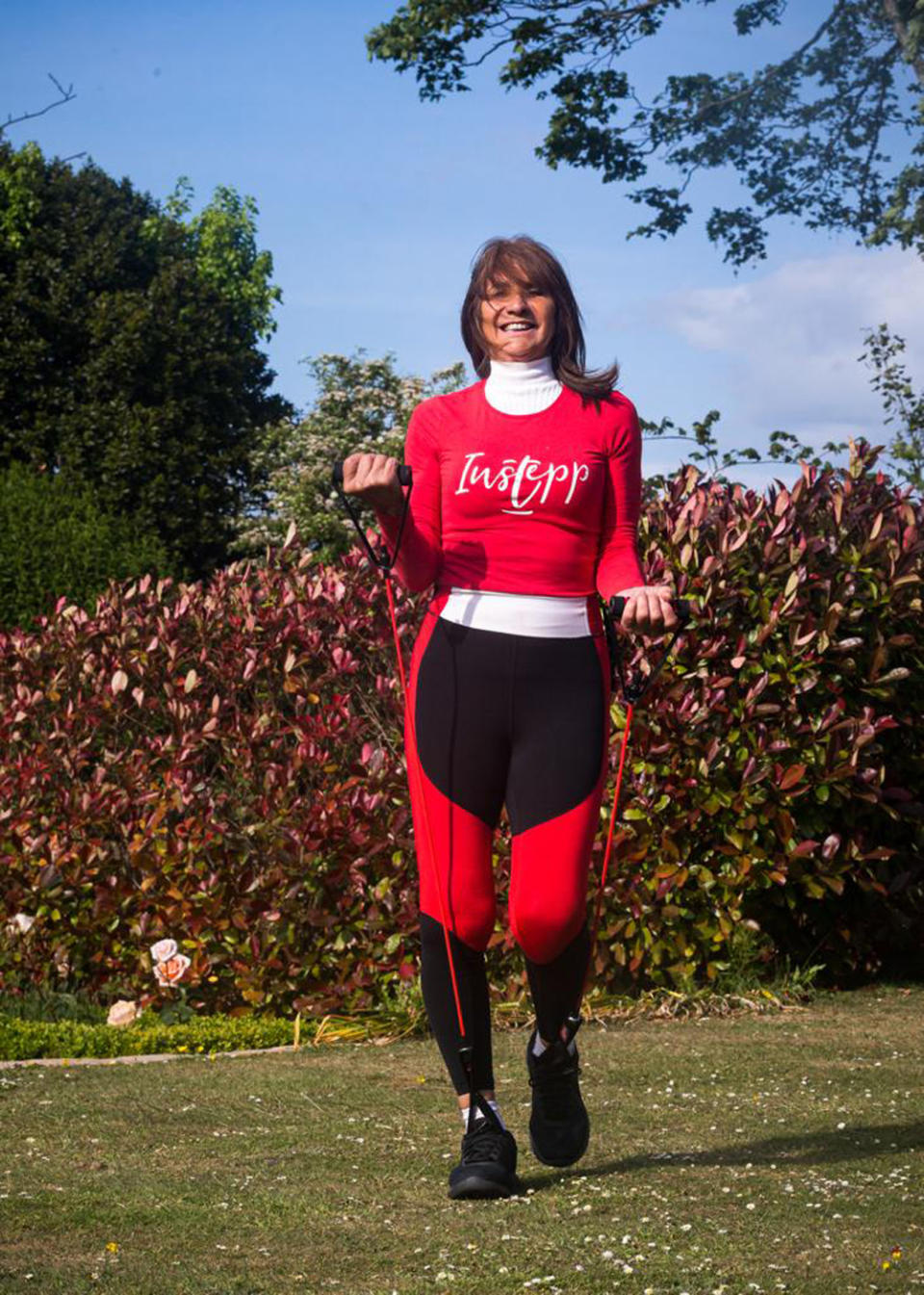 Julie Ford, 69, working out with her walking resistance band she created (Collect/PA Real Life)