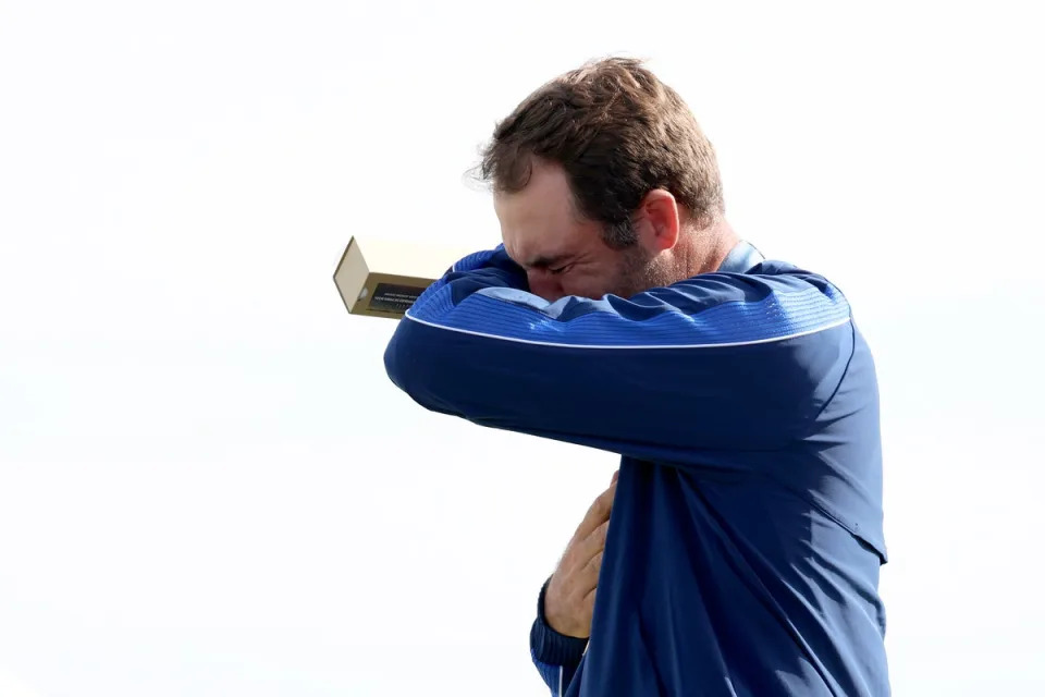 Scottie Scheffler, pictured, began to cry as he accepted the gold medal for Team USA after winning the men’s individual golf competition on Sunday (Getty Images)