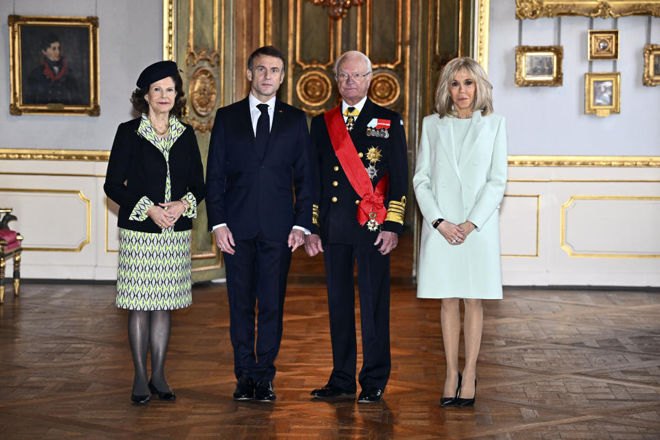 French President Emmanuel Macron, center left, and his wife Brigitte Macron, right, pose for a photo with Sweden's King Carl XVI Gustaf, center right, and Queen Silvia, left, at the Royal Palace in Stockholm, Sweden, Tuesday Jan. 30, 2024. France’s President Emmanuel Macron started a two-day state visit in Stockholm during which he will meet Swedish prime minister, Ulf Kristersson, and the country’s monarch, King Carl XVI Gustaf. (Claudio Bresciani/TT via AP)