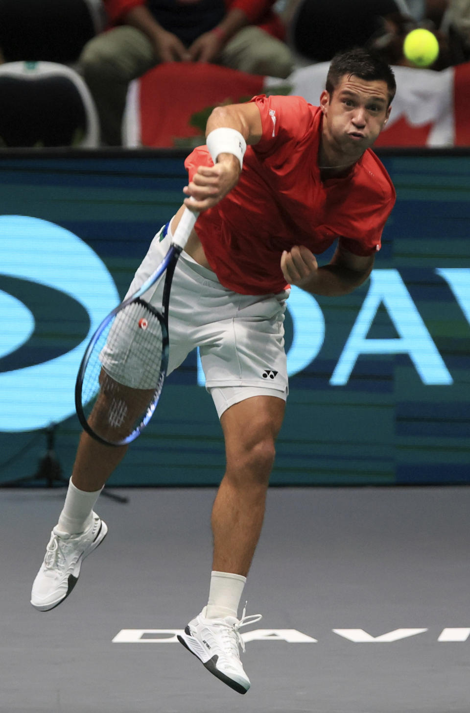 Canada's Alexis Galarneau serves the ball to Chile's Alejandro Tabilo during the men's single Davis Cup group A tennis match between Chile and Canada, in Bologna, Saturday Sept. 16, 2023. (Michele Nucci/LaPresse via AP)