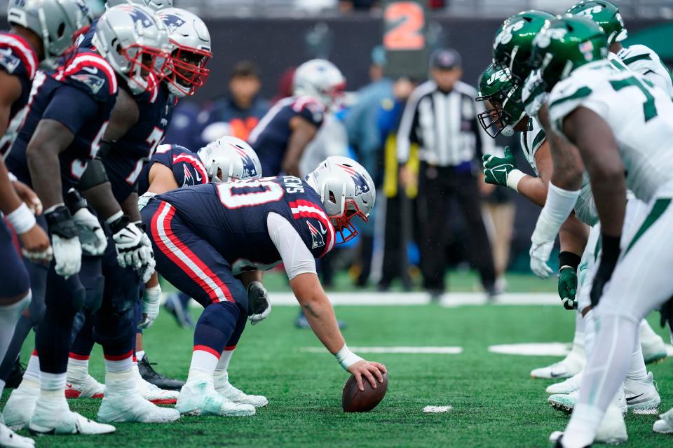 The New England Patriots offense line up against the New York Jets in the second half.