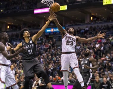 Jan 26, 2018; Milwaukee, WI, USA; Brooklyn Nets center Jarrett Allen (31) and Milwaukee Bucks guard Sterling Brown (23) reach for a rebound during the first quarter at BMO Harris Bradley Center. Mandatory Credit: Jeff Hanisch-USA TODAY Sports