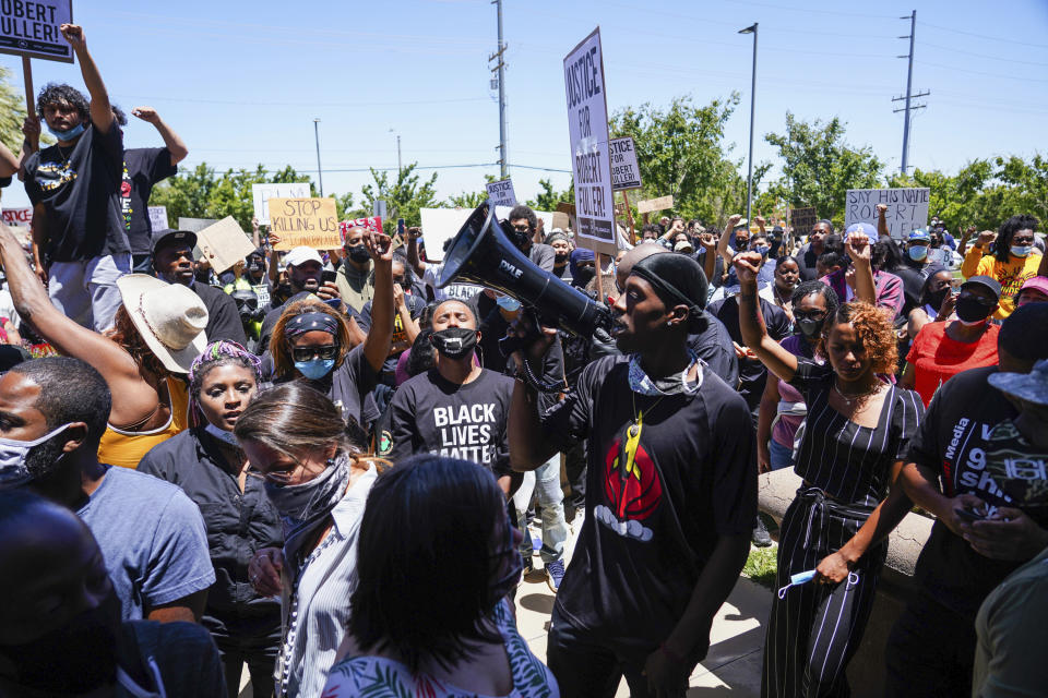 Protesters marched to demand an investigation into the death of 24-year-old Robert Fuller. Source: AP