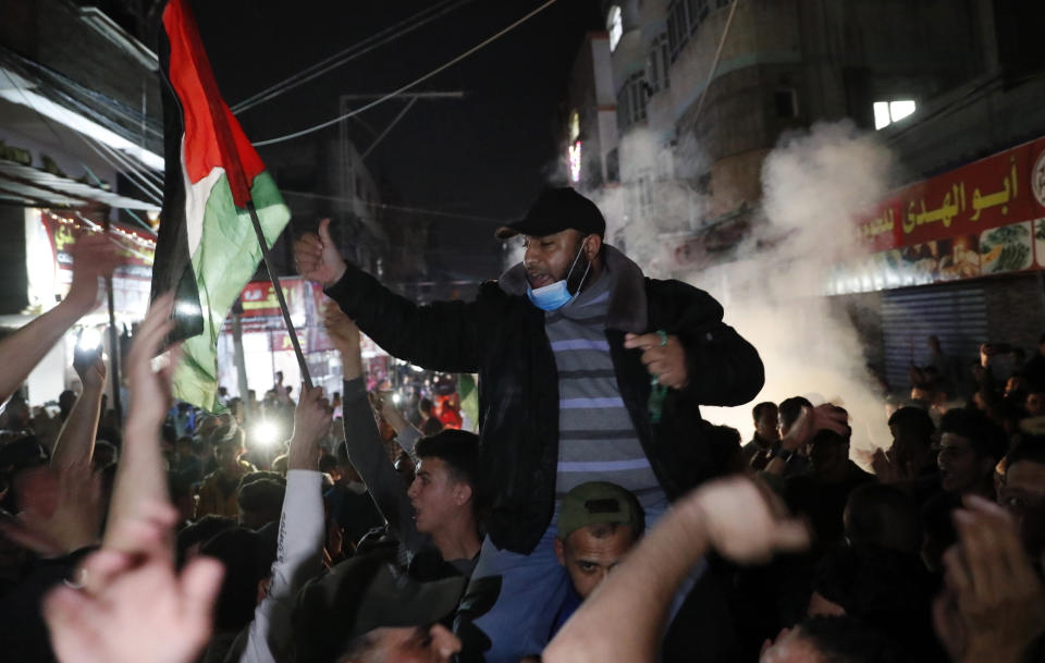 Protesters chant anti Israel slogans during a protest in solidarity with fellow Palestinian worshippers in Jerusalem, at the main street of Shati refugee camp in Gaza City, Saturday, April 24, 2021. (AP Photo/Adel Hana)