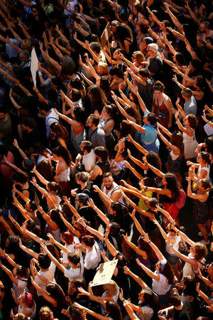 Protesters attend a demonstration against the release on bail of five men known as the "Wolf Pack" cleared of gang rape of a teenager and convicted of a lesser crime of sexual abuse in Madrid, Spain, June 22, 2018. REUTERS/Javier Barbancho