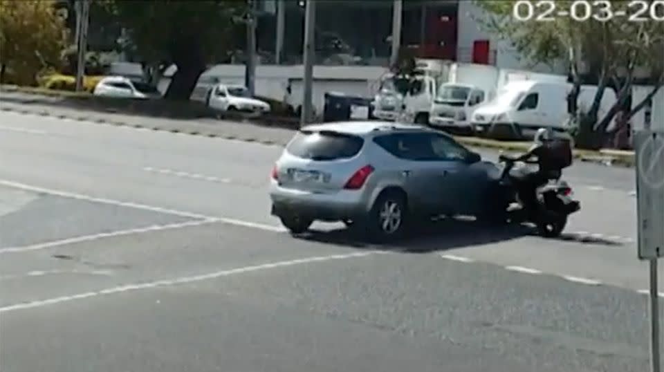 The driver can be seen creeping over the intersection. Source: 7 News