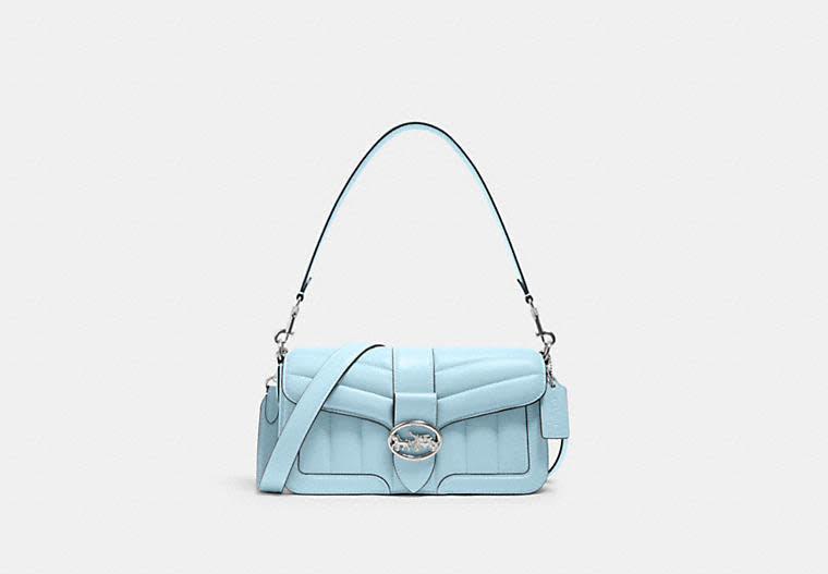 Product photo of baby blue Georgie Shoulder Bag With Puffy Quilting and silver hardware. Image via Coach Outlet.