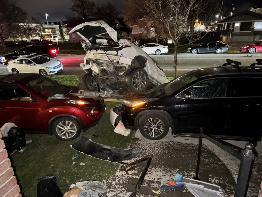 Two suspects allegedly involved in a police chase fled the scene unharmed after their vehicle flipped several times and landed on top of two cars in Provo. (Courtesy of Lexi Nelson)