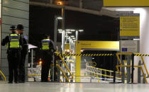 Police officers stand at the end of a tram platform following a stabbing at Victoria Station in Manchester, Britain, January 1, 2019. REUTERS/Phil Noble