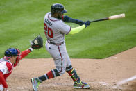 Atlanta Braves' Marcell Ozuna (20) swings for a strike during the seventh inning of a baseball game against the Philadelphia Phillies, Saturday, April 3, 2021, in Philadelphia. The All-Star Game patch that appeared on the right sleeve of the Braves' jerseys during opening day was sewn over Saturday against Philadelphia at Citizens Bank Park. (AP Photo/Laurence Kesterson)