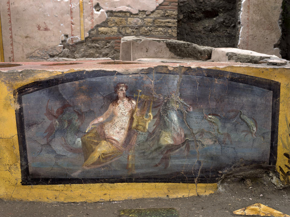 An undated photo made available by the Pompeii Archeological park press office shows the thermopolium in the Pompeii archeological park, near Naples, Italy. A fast-food eatery discovered at Pompeii is now completely excavated, helping to reveal some favorite dishes of citizens of the ancient Roman city who liked to eat out. Pompeii Archaeological Park’s longtime chief, Massimo Osanna said Saturday, Dec. 26, 2020, in a statement that while some 80 such fast-foods have been found at Pompeii, it is the first time such an eatery — known as a thermopolium since it serve hot foods — had been entirely excavated. (Luigi Spina/Parco Archeologico di Pompei via AP)