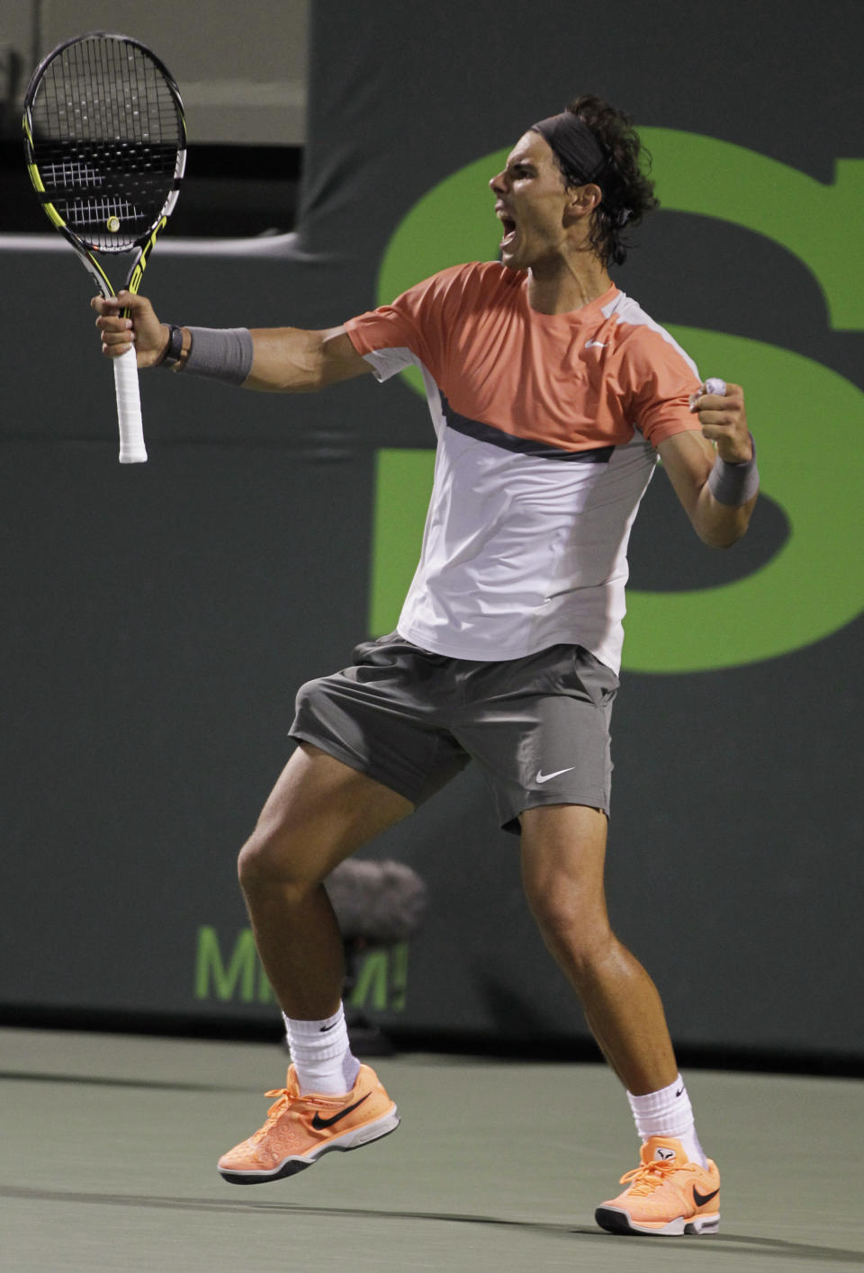 Rafael Nadal, of Spain, celebrates after defeating Milos Raonic, of Canada, 4-6, 6-2, 6-4 during the Sony Open tennis tournament, Thursday, March 27, 2014, in Key Biscayne, Fla. (AP Photo/Luis M. Alvarez)