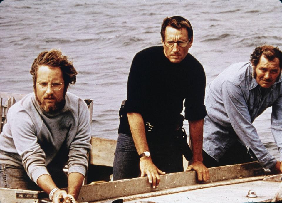 <p>Richard Dreyfuss, Roy Scheider, and Robert Shaw on board a boat in a still from the film <em>Jaws</em>, in 1975.</p>