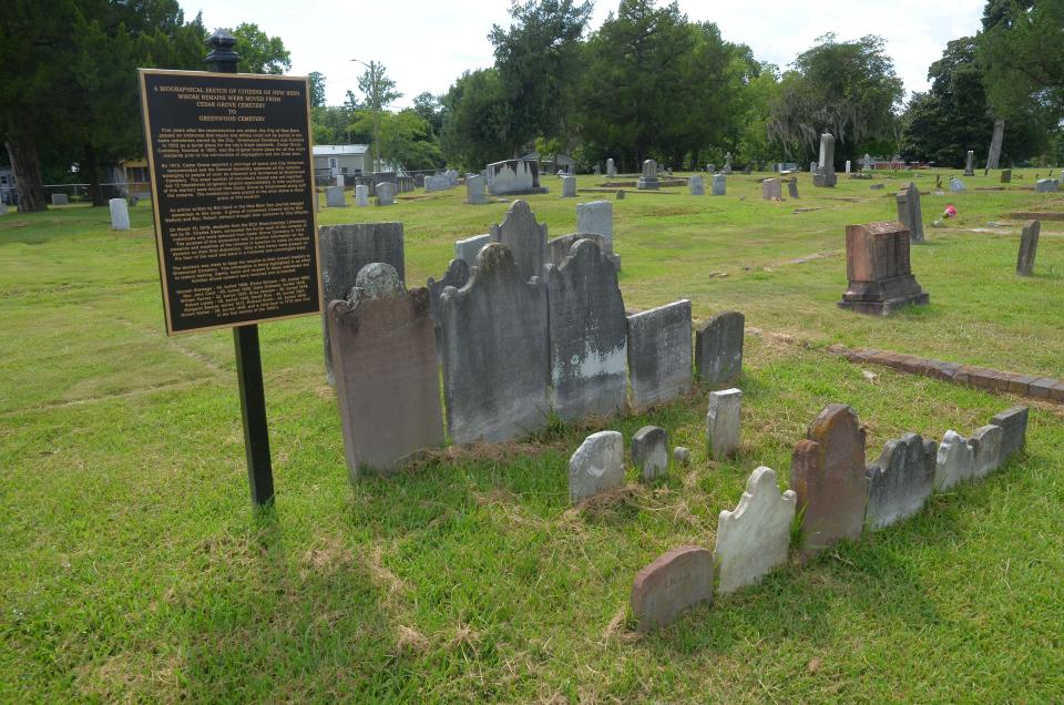 An historical marker commemorates the site where, in 1914, approximately a dozen Black citizens buried at Cedar Grove Cemetery were dug up by city employees and reinterred at Greenwood Cemetery.