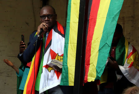 Pastor Evan Mawarire, leader of the #ThisFlag movement, addresses a prayer meeting called to celebrate after Zimbabwean President Robert Mugabe was dismissed as party leader at an extraordinary meeting of the ruling ZANU-PF's central committee in Harare, Zimbabwe, November 19, 2017. REUTERS/Philimon Bulawayo