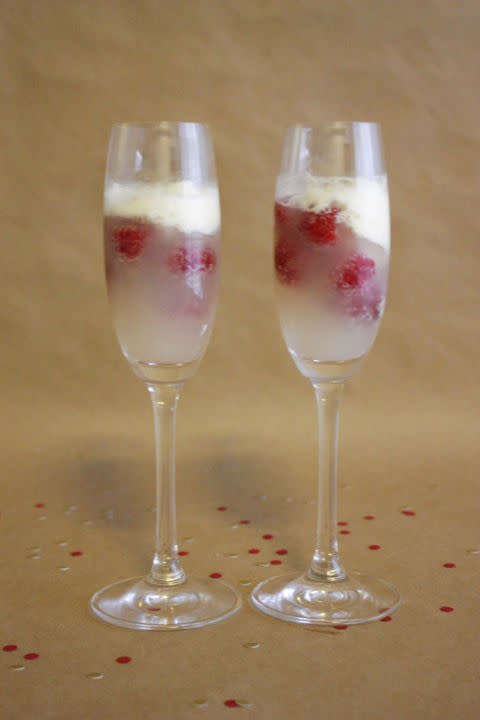 <p>Drop a scoop of vanilla ice cream and a few raspberries in your glass for a festive beverage. </p><p><strong>Get the recipe at <a rel="nofollow noopener" href="http://www.caitlincawley.com/2012/12/sweet-and-festive-champagne-cocktail.html" target="_blank" data-ylk="slk:Caitlin Cawley;elm:context_link;itc:0;sec:content-canvas" class="link ">Caitlin Cawley</a>.</strong></p>