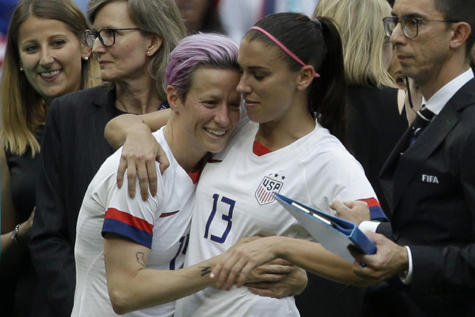FILE - United States' Megan Rapinoe, left, and Alex Morgan celebrate after winning the Women's World Cup final soccer match between U.S. and The Netherlands at the Stade de Lyon in Decines, outside Lyon, France, Sunday, July 7, 2019. Rapinoe and Morgan were included on the U.S. national team roster for the upcoming CONCACAF W Championship, which will determine four of the region’s teams in the 2023 Women’s World Cup. (AP Photo/Claude Paris, File)