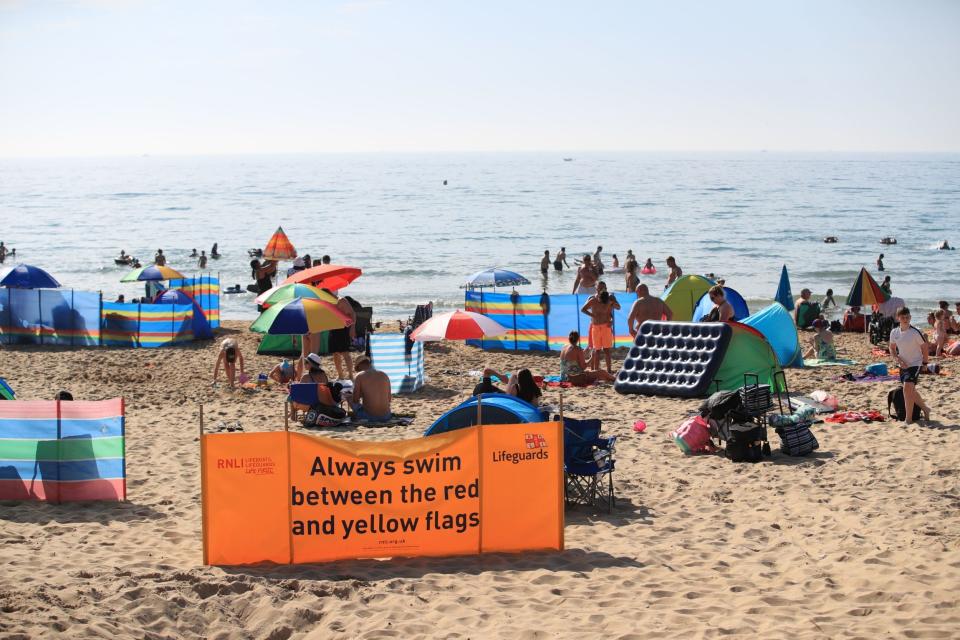 People on Bournemouth Beach enjoy the bank holiday weekend sunshine: Adam Davy/PA