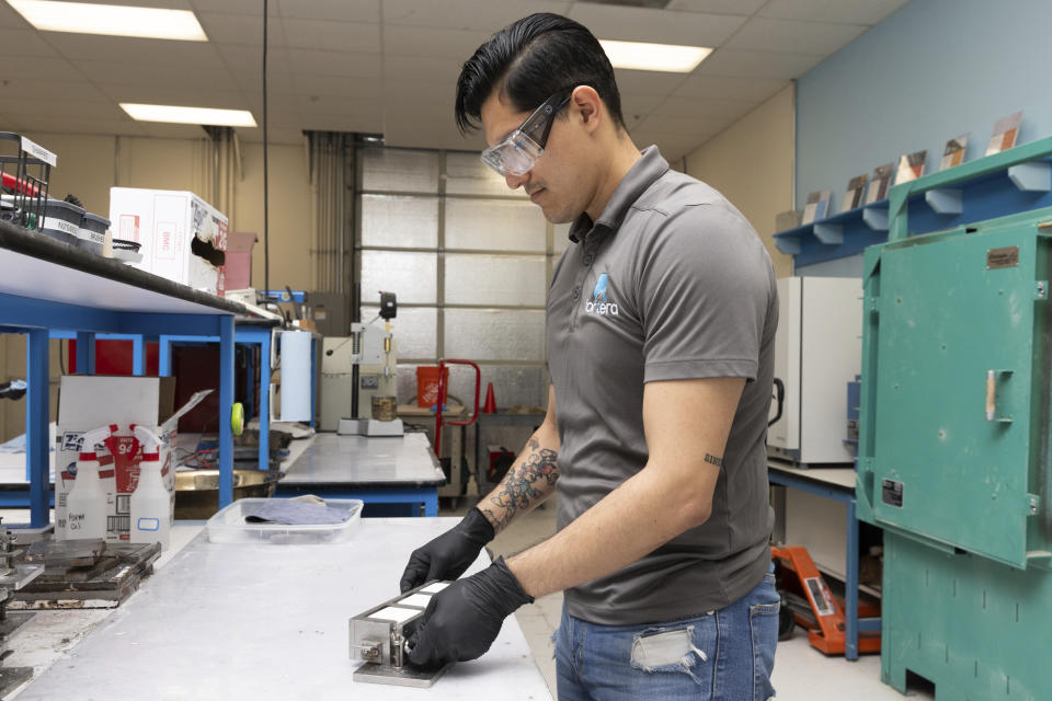 Jesus Gonzalez Pequeno works in the product lab at Fortera's facility in San Jose, Calif., Wednesday, April 10, 2024. The cement industry is one of the largest emitters of carbon dioxide and is responsible for about 8% of global emissions each year. Fortera, a clean tech company whose technology captures carbon emissions from kilns and feeds it back in to the process, is opening its first commercial scale operation on Thursday, April 12, 2024, in California. (AP Photo/Benjamin Fanjoy)