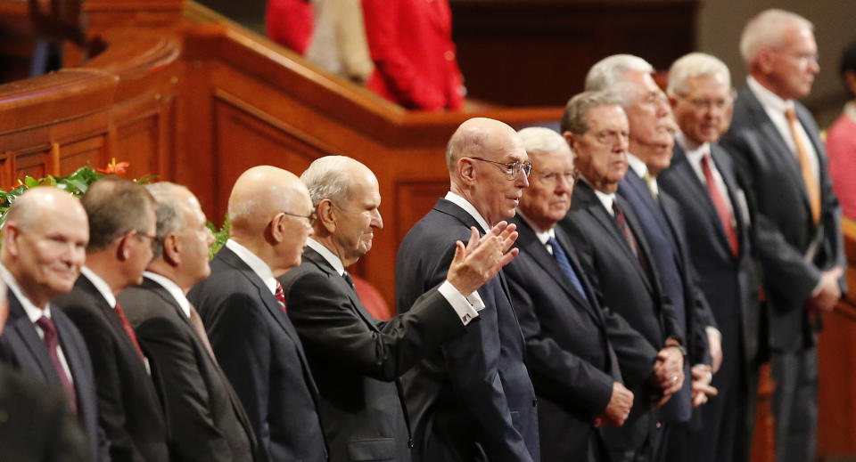 The Church of Jesus Christ of Latter-day Saints President Russell M. Nelson, center, greets the twice-annual conference of The Church of Jesus Christ of Latter-day Saints Saturday, Oct. 6, 2018, in Salt Lake City. Mormon leaders delivered spiritual guidance and church news as the faith's conference kicks off in Salt Lake City one day after the faith announced it was renaming the famed Mormon Tabernacle Choir to drop the word Mormon. The decision to rename the singing group the Tabernacle Choir at Temple Square was the first major move since church president Nelson in August called for an end to the use of shorthand names for the religion that have been used for generations by church members and the public.(AP Photo/Rick Bowmer)