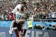 <p>Mexico’s Javier Hernandez, right, celebrates with teammates after scoring his side’s second goal during the group F match between Mexico and South Korea. </p>