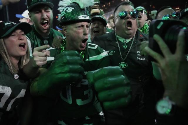New York Jets fans cheer during the first round of the NFL football draft