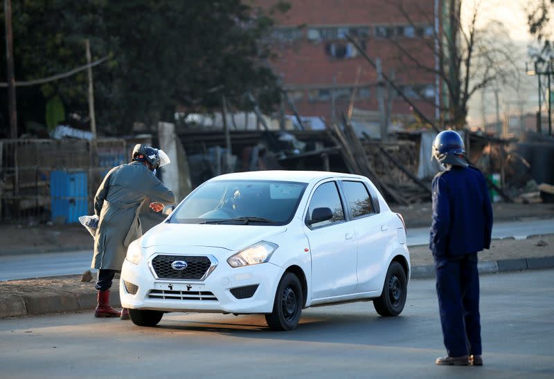 Police check vehicles ahead of planned anti-government protests in Harare