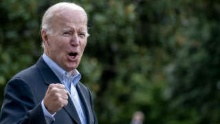 US President Joe Biden answers a shouted question from a reporter while walking to Marine One on the South Lawn of the White House in Washington, DC, on August 7, 2022, as he travels to Rehoboth Beach, Delaware. (Photo by Stefani Reynolds / AFP)