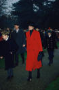 Princess Diana got into the festive mood in 1993 in this bright red coat with matching black accessories. Photo: Getty Images