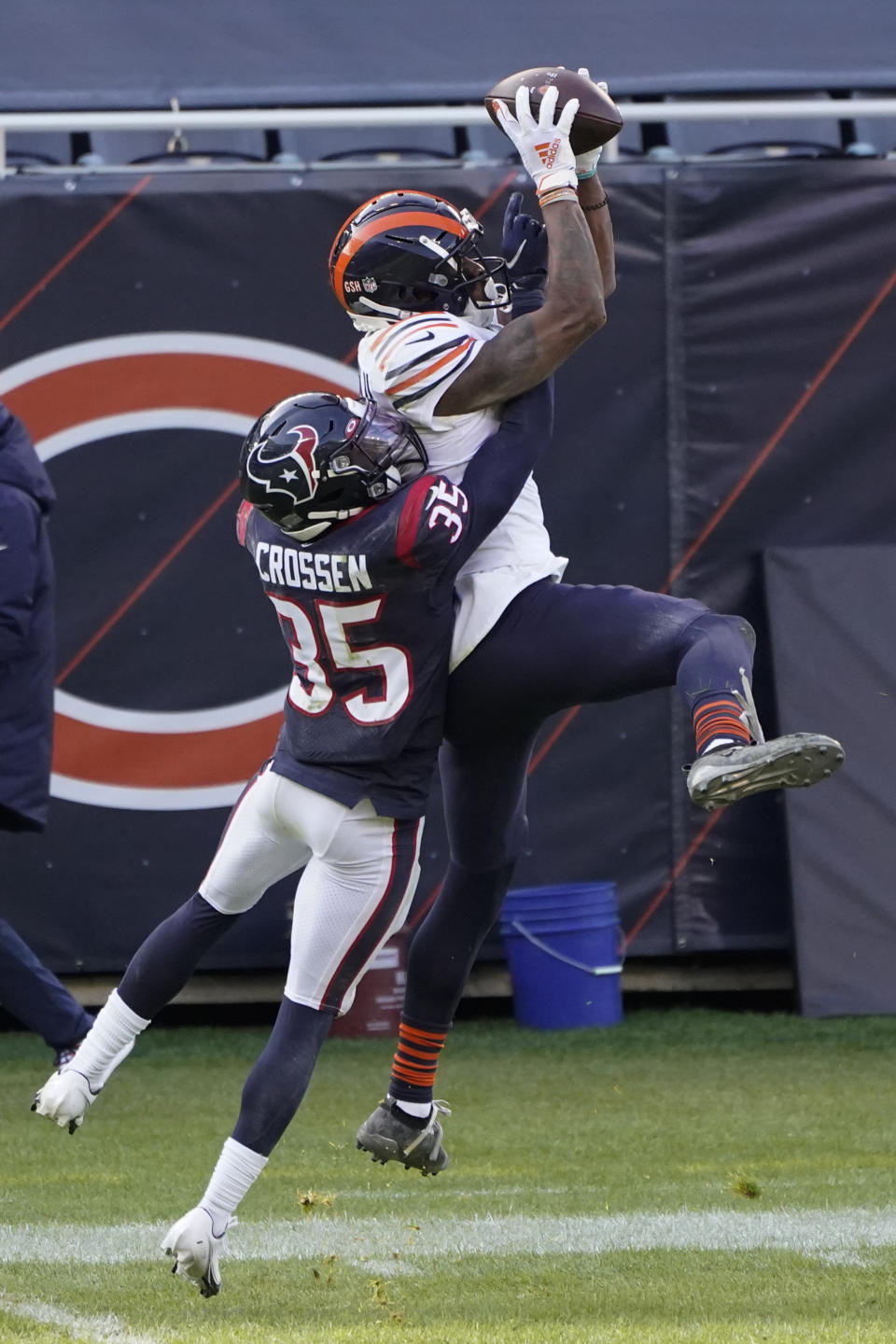 Chicago Bears' Allen Robinson (12) makes a catch against Houston Texans' Keion Crossen (35) during the first half of an NFL football game, Sunday, Dec. 13, 2020, in Chicago. (AP Photo/Charles Rex Arbogast)