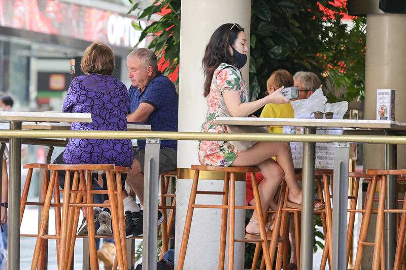 Locals are seen out and about in Queen St Mall, Brisbane.