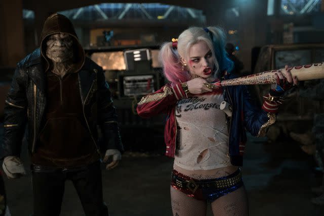 <p>Moviestore/Shutterstock</p> Adewale Akinnuoye-Agbaje (left) and Margot Robbie (right) in 'Suicide Squad'
