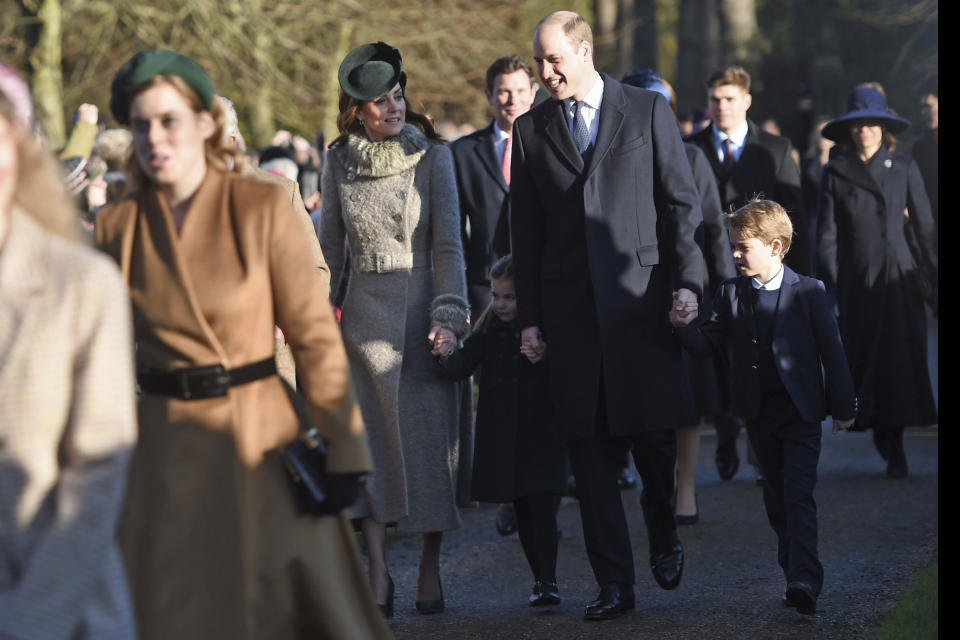 Kate, Duchess of Cambridge, Prince William and their children Prince George, right, and Princess Charlotte arrive to attend the Christmas Day morning church service at St. Mary Magdalene Church in Sandringham, Norfolk, England, Wednesday, Dec. 25, 2019. (Joe Giddens/PA via AP)