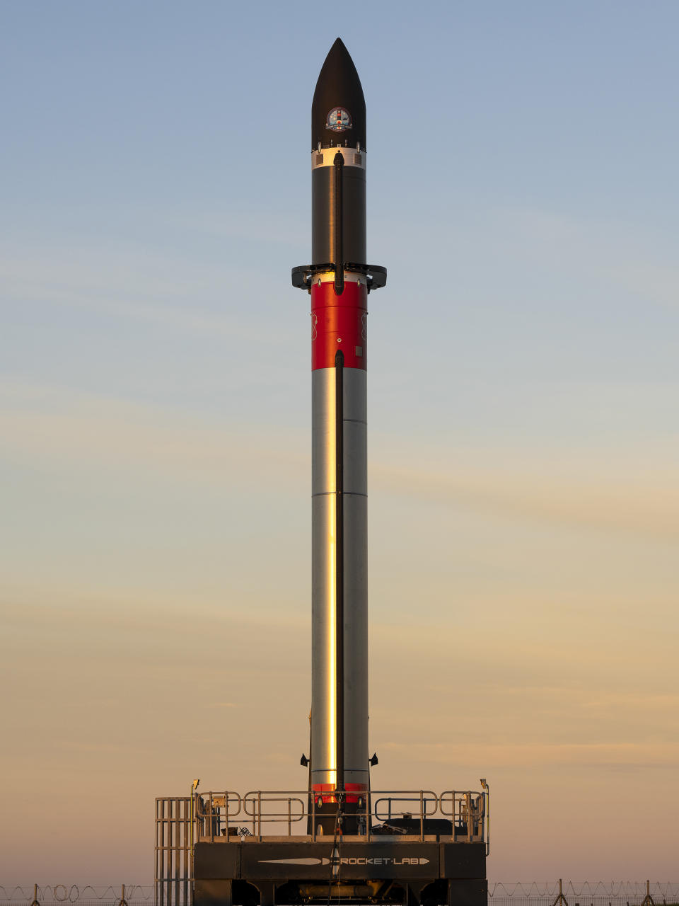 In this photo released by Rocket Lab, Rocket Lab's Electron rocket sits on the launch pad on the Mahia peninsula in New Zealand on May 10, 2022. NASA plans to send up a satellite to track a new orbit around the moon which it hopes to use in the coming years to once again land astronauts on the lunar surface. (Rocket Lab via AP)