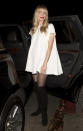 <p>King got black and white so right! She paired the simple, white and ultra-mini baby-doll dress with sheer tights and suede boots and topped it off with a punchy red lip. (Photo: Splash) </p>