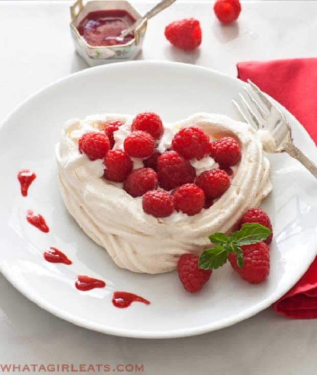 <p><a href="https://whatagirleats.com/meringue-hearts-with-whipped-cream-and-raspberries/" rel="nofollow noopener" target="_blank" data-ylk="slk:What A Girl Eats;elm:context_link;itc:0;sec:content-canvas" class="link ">What A Girl Eats</a></p>