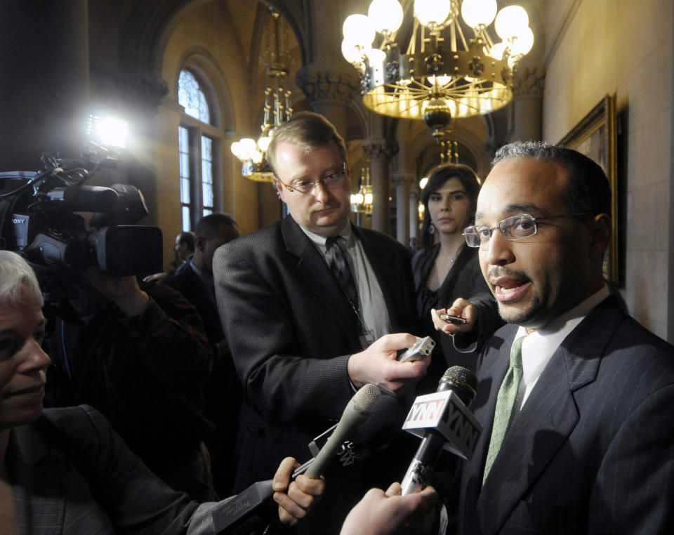 FILE - In this March 17, 2010, file photo, Sen. Jose Peralta, D-Queens, talks with reporters outside the Senate Chamber after being sworn into office during a ceremony at the Capitol in Albany, N.Y. State Sen. Jose Peralta, a New York lawmaker who was the first Dominican-American elected to the Senate, died Wednesday, Nov. 21, 2018. The Democrat was 47 and nearing the end of nearly two decades in office after losing a primary this fall. (AP Photo/Hans Pennink, File)